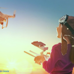 A child flying a drone into the sunset. Drones for beginners.